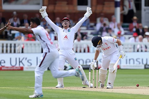 Root, right is bowled out by West Indies' Gudakesh Motie